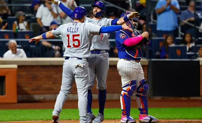 Chicago Cubs' Dansby Swanson (7) celebrates with Carson Kelly (15) after hitting a two-run home run against the New York Mets during the fourth inning of a baseball game, Tuesday, June 23, 2026, in New York. (AP Photo/Noah K. Murray)