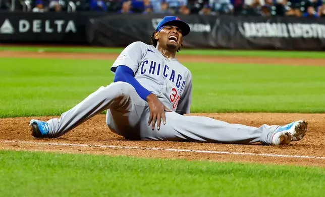 Chicago Cubs' pitcher Edward Cabrera (30) reacts after an injury during the fifth inning of a baseball game against the New York Mets , Tuesday, June 23, 2026, in New York. (AP Photo/Noah K. Murray)