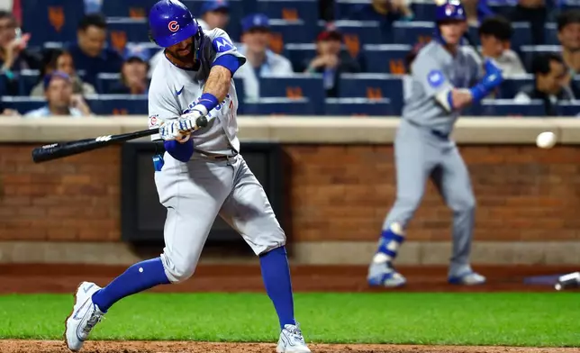 Chicago Cubs' Dansby Swanson hits a two-run home run against the New York Mets during the fourth inning of a baseball game, Tuesday, June 23, 2026, in New York. (AP Photo/Noah K. Murray)