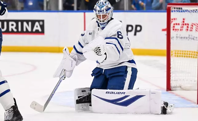 FILE - Toronto Maple Leafs goaltender Joseph Woll (60) makes a glove save against the Toronto Maple Leafs during the second period of an NHL hockey game, March 28, 2026, in St. Louis. (AP Photo/Connor Hamilton, File)