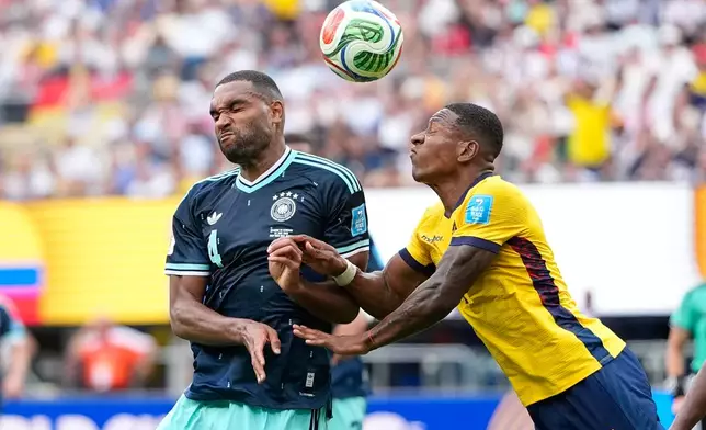 Ecuador's Pervis Estupinan, right, and Germany's Jonathan Tah vie for the ball during the World Cup Group E soccer match between Ecuador and Germany in East Rutherford, N.J., near New York, Thursday, June 25, 2026. (AP Photo/Frank Franklin II)