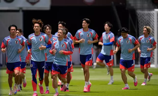 Member of the Japanese national team work out during a training session in Houston, Sunday, June 28, 2026, ahead of their round of 32 FIFA World Cup soccer game against Brazil. (AP Photo/Ashley Landis)