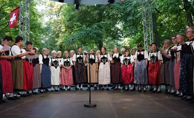 Yodelers prepare for TV broadcast on the main festival stage at Petersplatz in Basel, Switzerland, Saturday, June 27, 2026. (AP Photo/Jez Fielder)