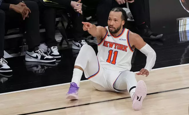 New York Knicks guard Jalen Brunson motion after a basket against the San Antonio Spurs during the second half of Game 1 of the NBA Finals basketball series, Wednesday, June 3, 2026, in San Antonio. (AP Photo/Eric Gay)