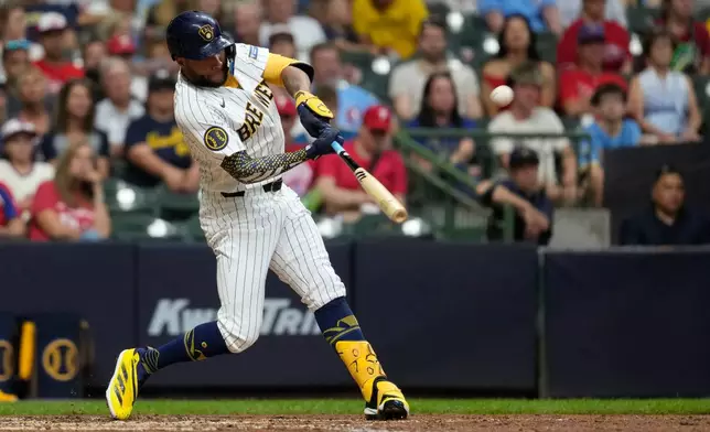 Milwaukee Brewers' Jackson Chourio hits a two-run home run during the seventh inning of a baseball game against the Philadelphia Phillies, Saturday, June 13, 2026, in Milwaukee. (AP Photo/Aaron Gash)