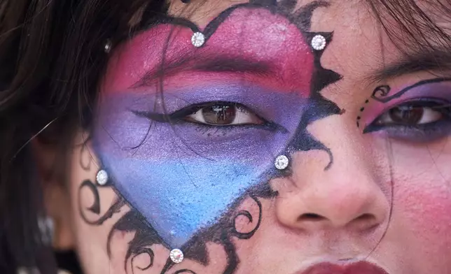 A participant has face painted as members of the LGBTQ+ community and supporters take out a Pride Month rally in Kathmandu, Nepal, on Saturday, June 13, 2026. (AP Photo/Niranjan Shrestha)