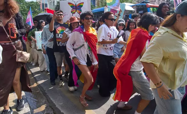 Members and supporters of the LGBTQ+ community participate in a Pride Month rally in Kathmandu, Nepal, on Saturday, June 13, 2026. (AP Photo/Niranjan Shrestha)