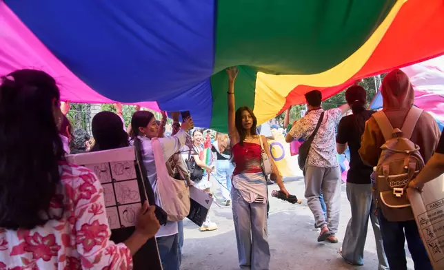 Members and supporters of the LGBTQ+ community participate in a Pride Month rally in Kathmandu, Nepal, on Saturday, June 13, 2026. (AP Photo/Niranjan Shrestha)