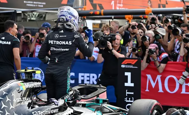 Mercedes driver Andrea Kimi Antonelli of Italy celebrates after setting the pole position during the qualifying session for the Monaco F1 Grand Prix, at the Monaco racetrack, Saturday, June 6, 2026. (AP Photo/Philippe Magoni)