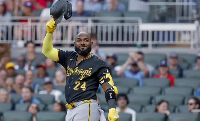 Pittsburgh Pirates designated hitter Marcell Ozuna acknowledges applause by Atlanta Braves fans during his first at-bat against the Braves during the second inning of a baseball game, Friday, June 5, 2026, in Atlanta. (AP Photo/Erik S. Lesser)