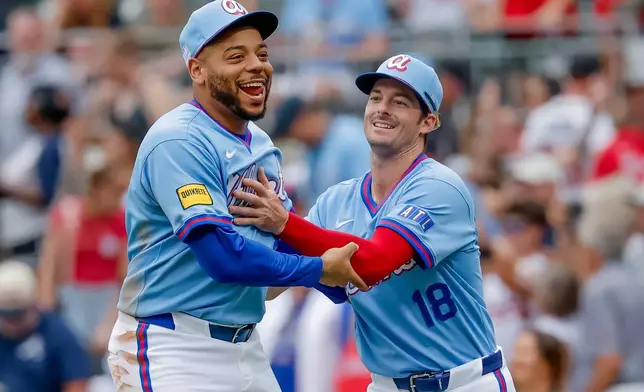 Atlanta Braves' Dominic Smith, left, reacts with teammate Mike Yastrzemski, right, after the Braves defeated the Pittsburgh Pirates in a baseball game, Saturday, June 6, 2026, in Atlanta. (AP Photo/Erik S. Lesser)