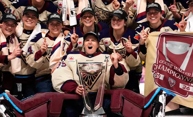 FILE - The Montreal Victoire pose for a photo with the PWHL Walter Cup after the team's win against the Ottawa Charge, in Ottawa, May 20, 2026. (Justin Tang/The Canadian Press via AP, File)