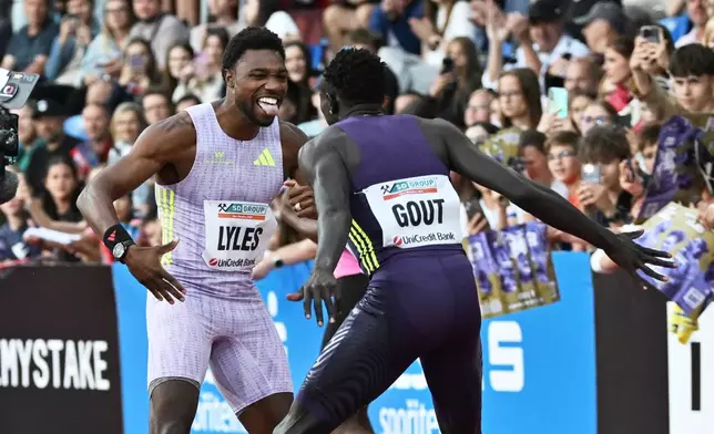 Noah Lyles of United States celebrates with Gout Gout of Australia after winning the men's 150 meters event at the Golden Spike athletics meeting in Ostrava, Czech Republic, Tuesday, June 16, 2026. (AP Photo/Lukas Kabon)