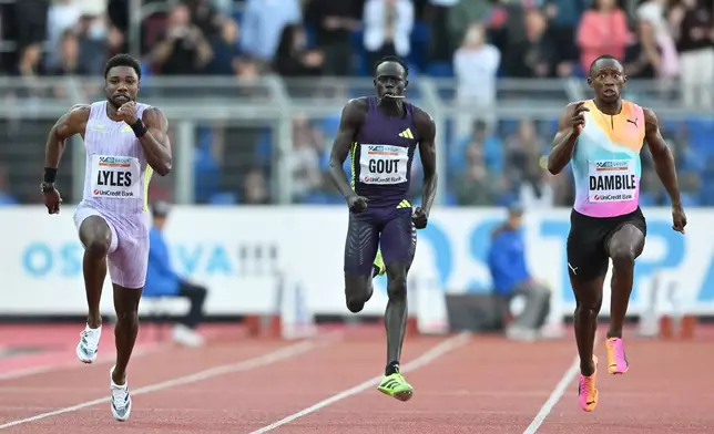Noah Lyles of United States, left, Gout Gout of Australia and Sinesipho Dambile of South Africa, right, compete during the men's 150 meters event at the Golden Spike athletics meeting in Ostrava, Czech Republic, Tuesday, June 16, 2026. (AP Photo/Lukas Kabon)