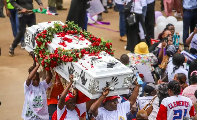 Demonstrators carry a coffin, during a march against rising cases of femicide, in downtown Nairobi, Kenya, Monday, June 1, 2026. (AP Photo/Patrick Ngugi)