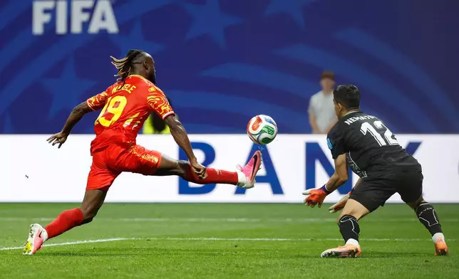 Congo's Fiston Mayele (19) scores their second goal against Uzbekistan goalkeeper Abduvohid Nematov (12) during the World Cup Group K soccer match between DR Congo and Uzbekistan in Atlanta, Saturday, June 27, 2026. (AP Photo/Erik S. Lesser)