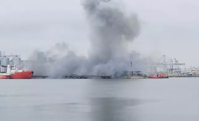 In this photo taken from video provided by OBSERVATOR ANTENA 1, smoke rises after an explosion of sea drone is seen in Constanta port, Romania, Friday, June 5, 2026. (OBSERVATOR ANTENA 1 via AP)