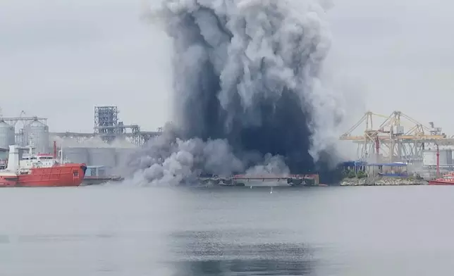 In this photo taken from video provided by OBSERVATOR ANTENA 1, an explosion of sea drone is seen in Constanta port, Romania, Friday, June 5, 2026. (OBSERVATOR ANTENA 1 via AP)