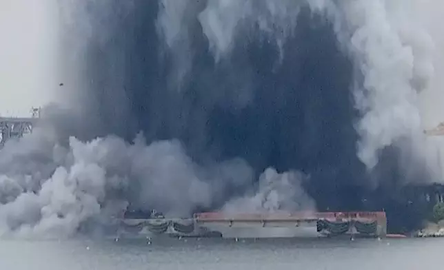 In this photo taken from video provided by OBSERVATOR ANTENA 1, an explosion of sea drone is seen in Constanta port, Romania, Friday, June 5, 2026. (OBSERVATOR ANTENA 1 via AP)