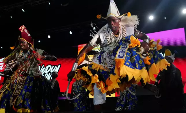 FILE - Voodoo worshippers dance during the annual Voodoo Festival in Ouidah, Benin, Jan. 10, 2025. (AP Photo/Sunday Alamba, File)