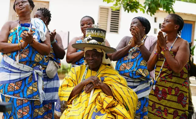Daagbo Hounon Houna II, the Supreme Spiritual Voodoo Chief, surrounded by priestesses, is interviewed by The Associated Press, in Ouidah, Benin, May 14, 2026. (AP Photo/Sunday Alamba)