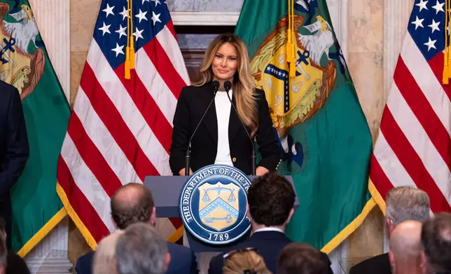First lady Melania Trump speaks about Trump Accounts for children in foster care at the Department of Treasury, Thursday, June 11, 2026, in Washington. (AP Photo/Allison Robbert)