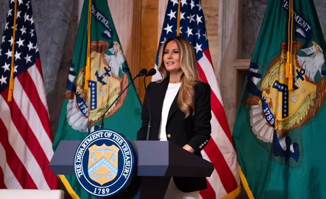 First lady Melania Trump speaks about Trump Accounts for children in foster care at the Department of Treasury, Thursday, June 11, 2026, in Washington. (AP Photo/Allison Robbert)