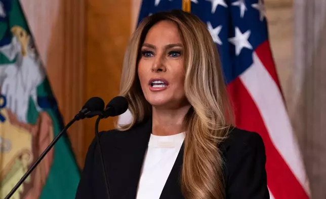 First lady Melania Trump speaks about Trump Accounts for children in foster care at the Department of Treasury, Thursday, June 11, 2026, in Washington. (AP Photo/Allison Robbert)