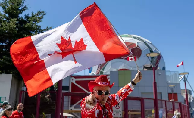 Canada's Voyageurs parade toward B.C. Place ahead of Canada's World Cup Group B soccer match against Qatar, in Vancouver, on Thursday, June 18, 2026. (Timothy Matwey/The Canadian Press via AP)