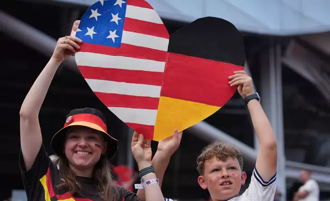 Fans hold up a heart shaped sign during international friendly soccer match between Germany and United States in Chicago, Saturday, June 6, 2026. (AP Photo/Nam Y. Huh)