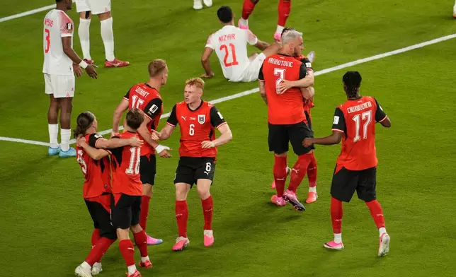 Austria players celebrate after Jordan's Yazan Alarab scored on his own goal during the World Cup Group J soccer match in Santa Clara, Calif., near San Francisco, Tuesday, June 16, 2026. (AP Photo/Jeff Chiu)