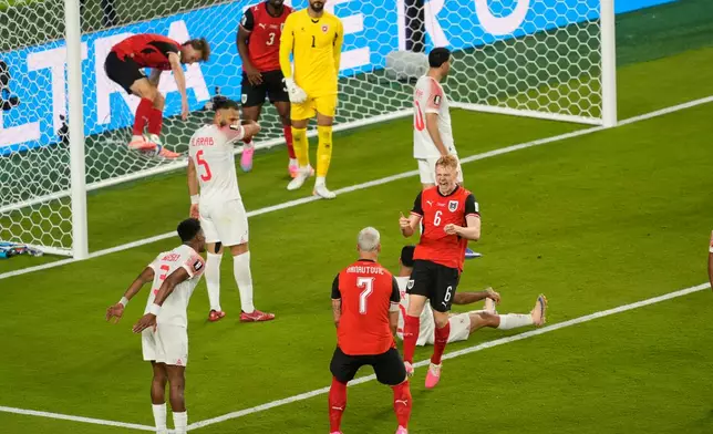 Austria's Marko Arnautovic, front, and Nicolas Seiwald celebrate after Jordan's Yazan Alarab scored on his own goal during the World Cup Group J soccer match in Santa Clara, Calif., near San Francisco, Tuesday, June 16, 2026. (AP Photo/Jeff Chiu)