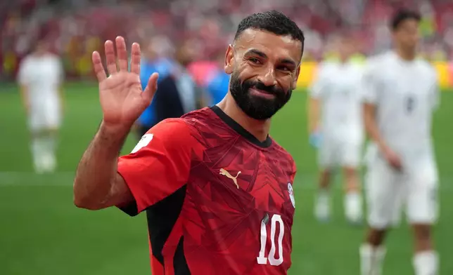 Egypt's Mohamed Salah (10) smiles and waves to fans as he leaves the field following the team's victory in the World Cup Group G soccer match between New Zealand and Egypt in Vancouver, British Columbia, Sunday, June 21, 2026. (Darryl Dyck/The Canadian Press via AP)