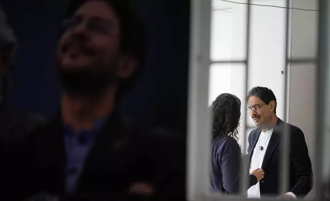 Ivan Cepeda arrives to give a news conference where he conceded defeat in the presidential election in Bogota, Colombia, Wednesday, June 24, 2026. (AP Photo/Ivan Valencia)