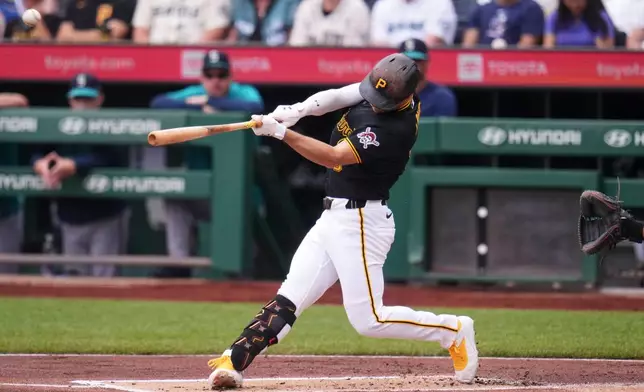 Pittsburgh Pirates' Brandon Lowe hits a solo home run off Seattle Mariners pitcher Bryce Miller during the first inning of a baseball game in Pittsburgh, Thursday, June 25, 2026. (AP Photo/Gene J. Puskar)