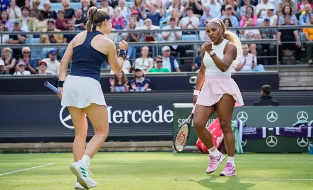 Serena Williams of the U.S., right, reacts as she and Czech Republic's Karolina Muchova play during their round of 16 doubles match against New Zealand's Erin Routliffe and Mexico's Giuliana Olmo during the WTA 500 Berlin Open tennis tournament at Steffi Graf Stadium, in Berlin, Germany, Tuesday, June 16, 2026. (AP Photo/Ebrahim Noroozi)