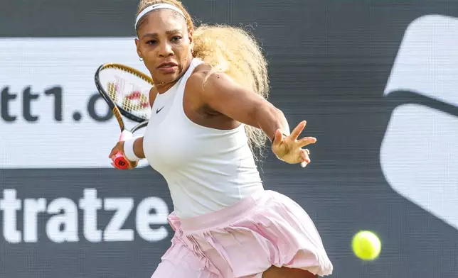 Serena Williams plays a forehand next to Karolina Muchova, not pictured, during first round women doubles tennis match against Routliffe and Olmos, in Berlin, Germany, Tuesday June 16, 2026. (Andreas Gora/dpa via AP)