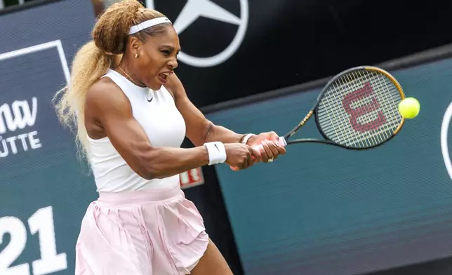 Serena Williams plays a backhand next to Karolina Muchova, not pictured, during first round women doubles tennis match against Routliffe and Olmos, in Berlin, Germany, Tuesday June 16, 2026. (Andreas Gora/dpa via AP)