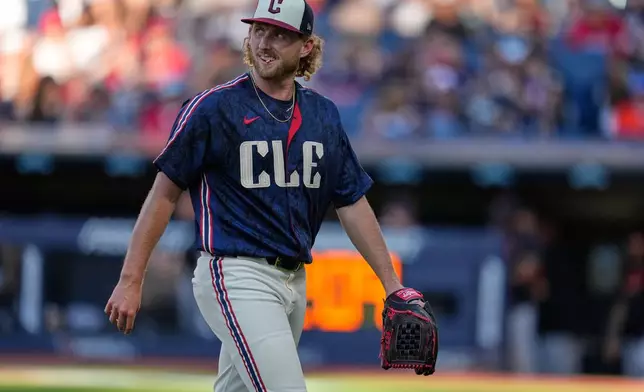 Cleveland Guardians' Tanner Bibee walks off the field in the first inning of a baseball game against the Detroit Tigers in Cleveland, Friday, June 12, 2026. (AP Photo/Sue Ogrocki)