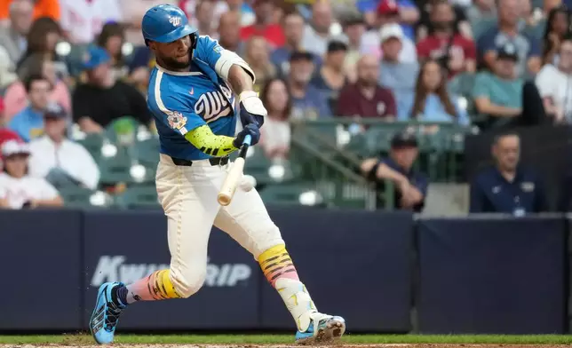 Milwaukee Brewers' Jackson Chourio hits an RBI single during the sixth inning of a baseball game against the Philadelphia Phillies, Friday, June 12, 2026, in Milwaukee. (AP Photo/Aaron Gash)