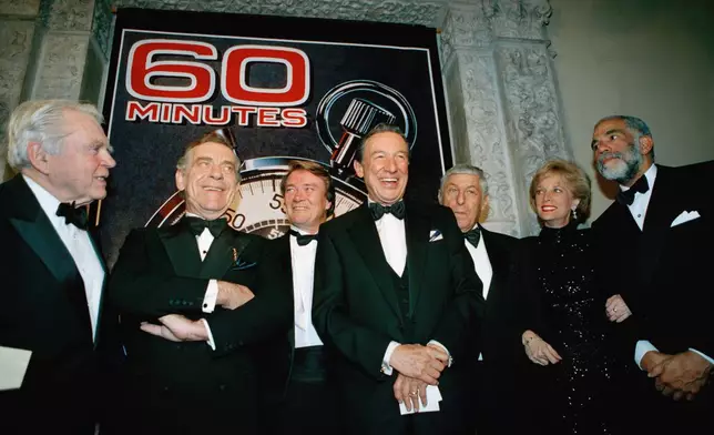 FILE - The "60 Minutes" team, from left, Andy Rooney, Morley Safer, Steve Kroft, Mike Wallace, executive producer Don Hewitt, Lesley Stahl, and Ed Bradley pose at the Metropolitan Museum of Art in New York celebrating their 25th anniversary, on Nov. 10, 1993. (AP Photo/Mark Lennihan, File)