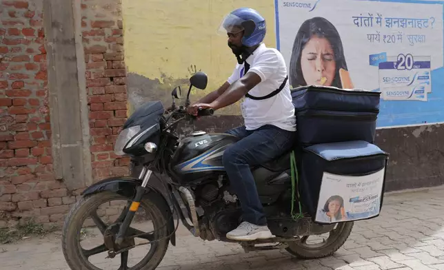 Haleon Health Ambassador on motorbike, equipped with testing kits, samples and diagnostic tools
