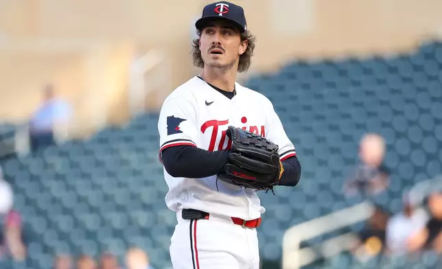 Minnesota Twins starting pitcher Joe Ryan looks on during the first inning of a baseball game against the Chicago White Sox, Monday, June 1, 2026, in Minneapolis. (AP Photo/Matt Krohn)