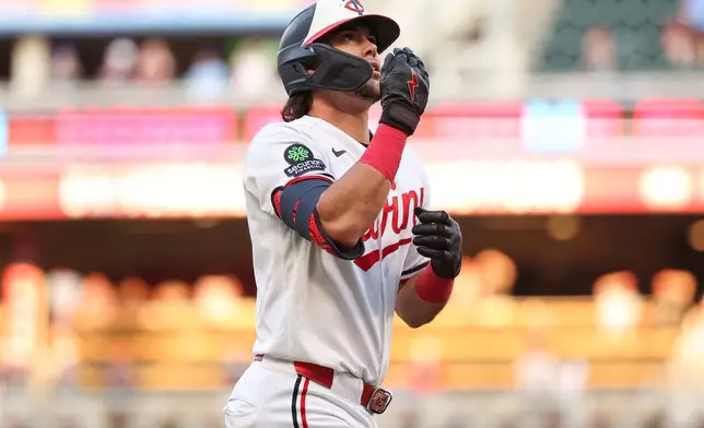 Minnesota Twins' Tristan Gray celebrates after his grand slam against the Chicago White Sox during the fourth inning of a baseball game, Monday, June 1, 2026, in Minneapolis. (AP Photo/Matt Krohn)