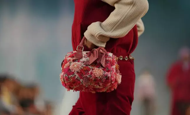 A model wears a creation as part of the Louis Vuitton men's Spring Summer 2027 collection presented in Paris, France, Tuesday, June 23, 2026. (AP Photo/Aurelien Morissard)