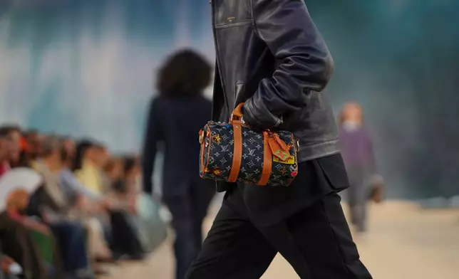 A model wears a creation as part of the Louis Vuitton men's Spring Summer 2027 collection presented in Paris, France, Tuesday, June 23, 2026. (AP Photo/Aurelien Morissard)