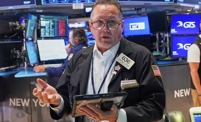 Trader Edward Curran works on the floor of the New York Stock Exchange, Friday, June 26, 2026. (AP Photo/Richard Drew)