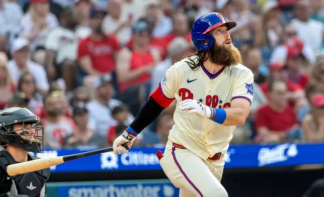 Philadelphia Phillies' Brandon Marsh follows through on a solo home run during the sixth inning of a baseball game against the Chicago White Sox, Saturday, June 6, 2026, in Philadelphia. (AP Photo/Laurence Kesterson)