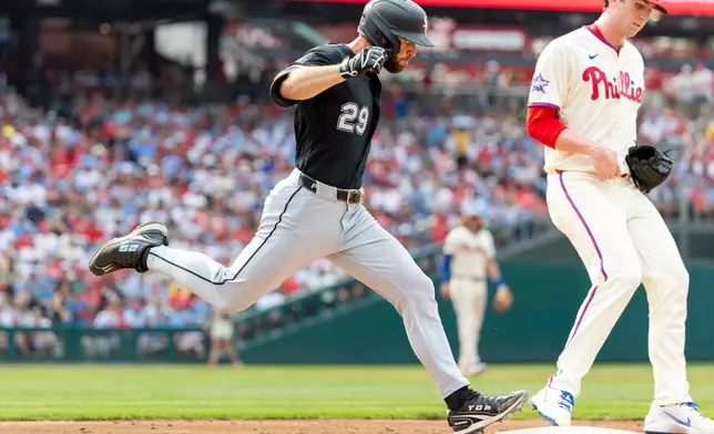 Chicago White Sox' Tristan Peters (29) is out at first as Philadelphia Phillies pitcher Andrew Painter touches the bag in the third inning of a baseball game, Saturday, June 6, 2026, in Philadelphia. (AP Photo/Laurence Kesterson)