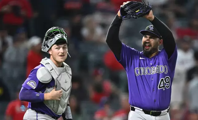Colorado Rockies pitcher Antonio Senzatela (49) gestures after getting a double play during the ninth inning of a baseball game to defeat the Los Angeles Angels, Monday, June 1, 2026, in Anaheim, Calif. (AP Photo/William Liang)